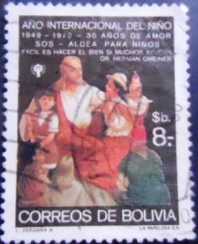 Selo postal da Bolívia de 1979 Christ with children in national costume