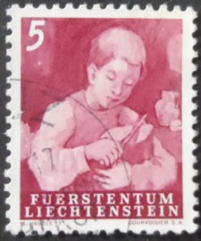 Selo postal de Liechtenstein de 1951 Boy Cutting Bread